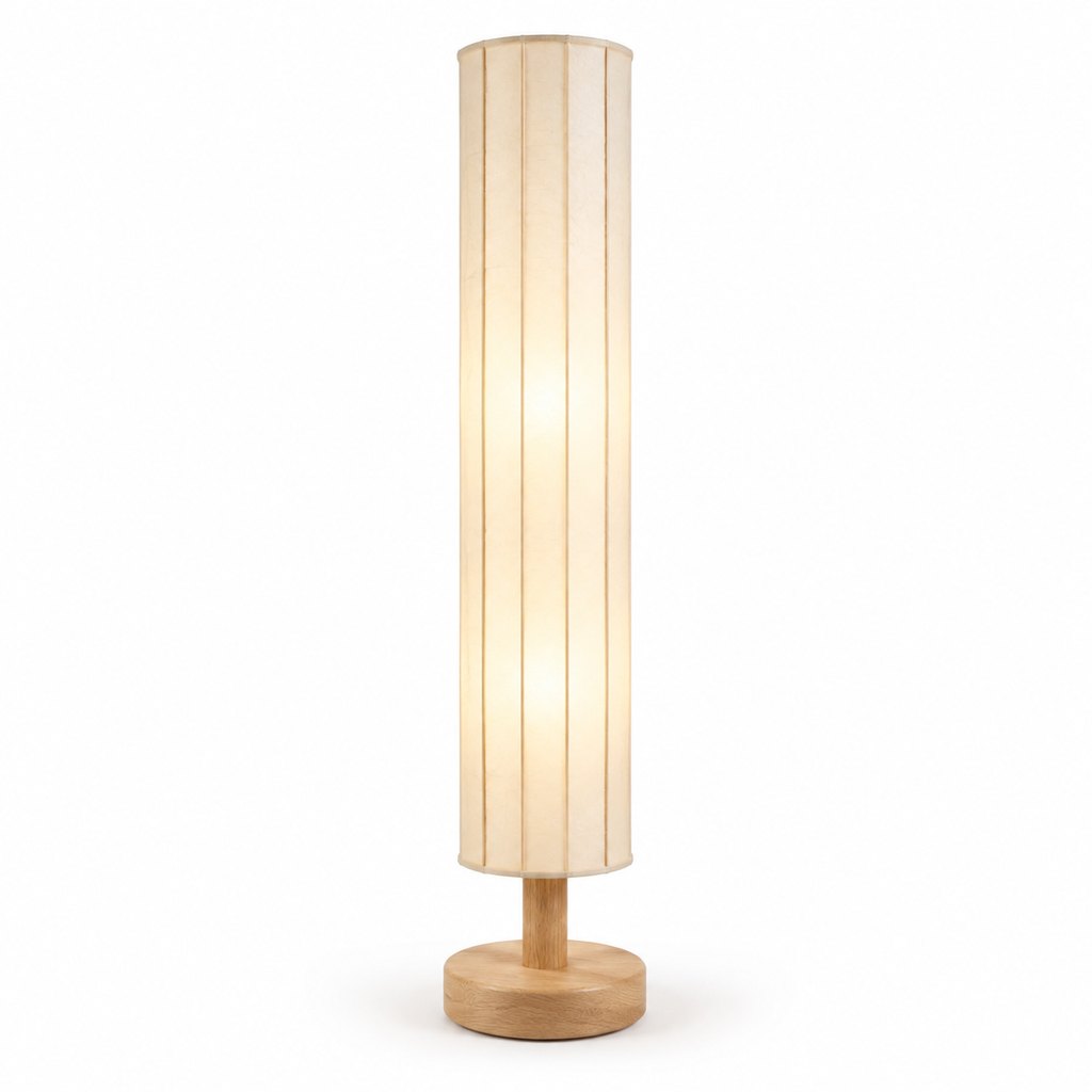 Akari rice-paper floor lamp with oak base glowing warmly in a dim room